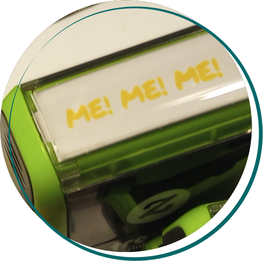 A rubber stamp saying Me! Me! Me!