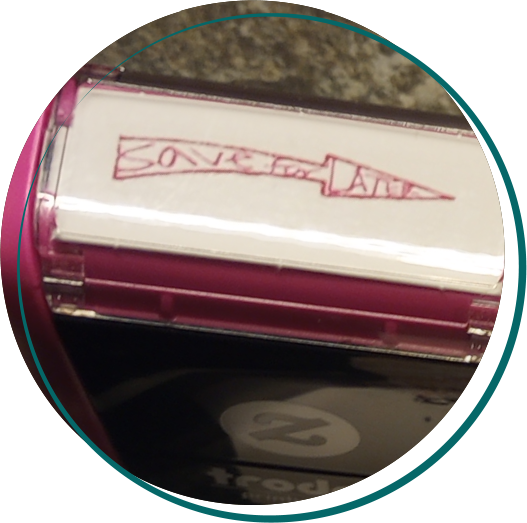 A rubber stamp with Save for Later squished into an arrow shape.