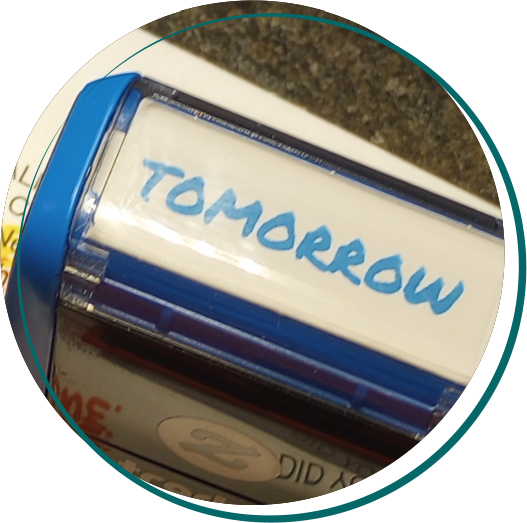A rubber stamps saying Tomorrow.